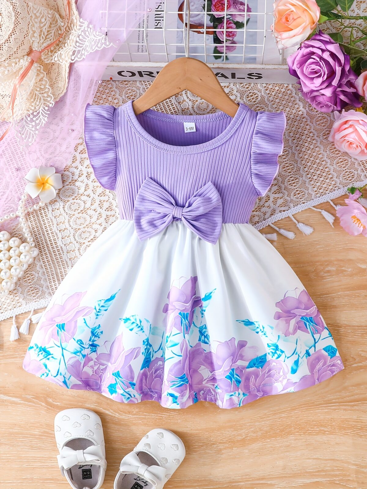 A little girl wearing a charming summer floral print dress