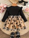 Baby girl wearing an adorable floral print dress perfect for spring or autumn