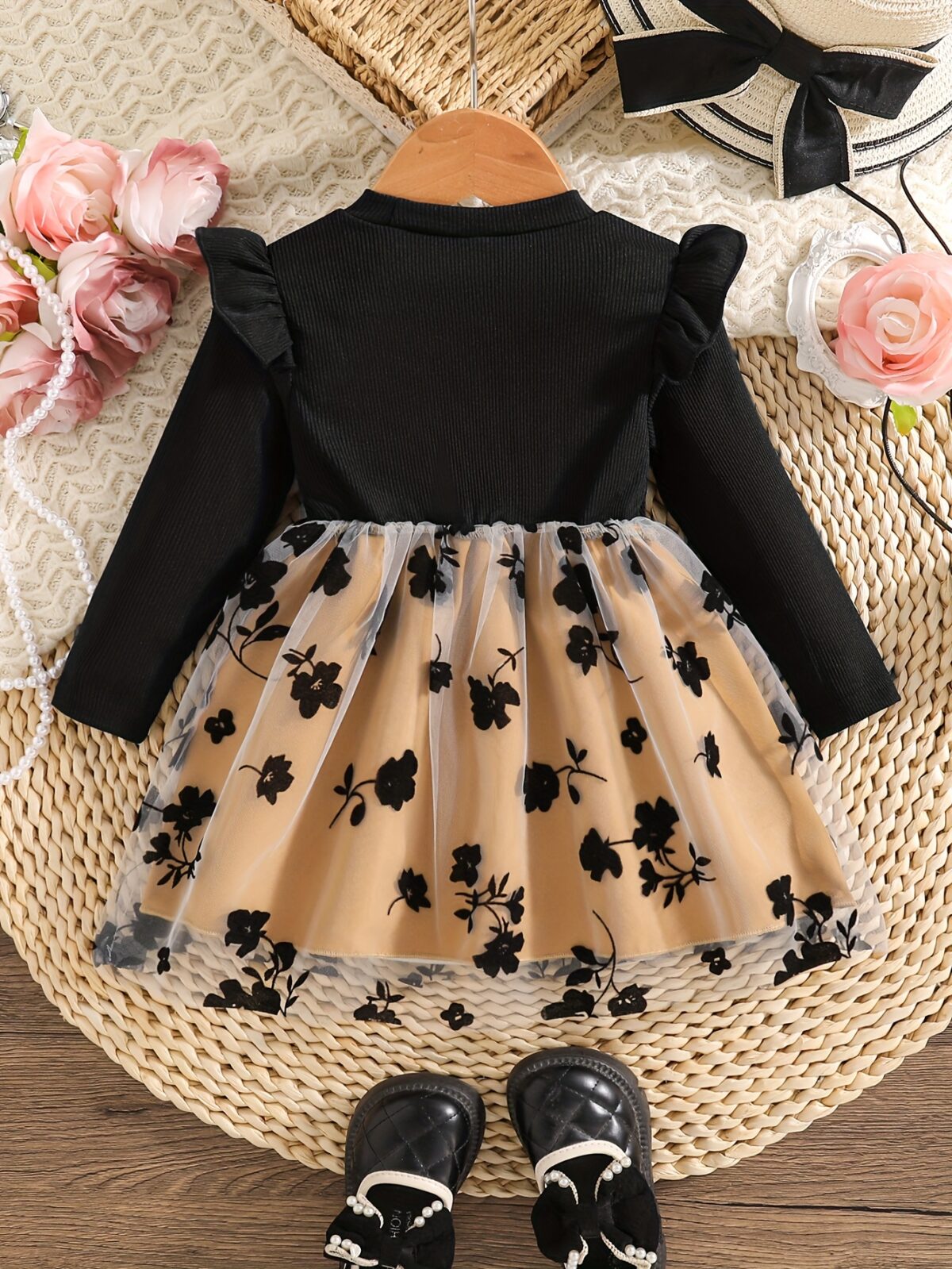 Baby girl wearing an adorable floral print dress perfect for spring or autumn