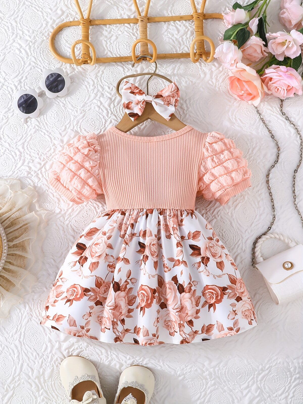 Adorable baby girl wearing a charming Seraphina floral print dress perfect for summer