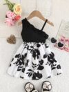 Adorable girl wearing a vibrant Summer Bloom floral print dress perfect for summer vacations