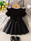 Adorable baby girl wearing a charming Little Darling Baby Bow Dress perfect for parties or playdates The dress features a beautiful bow detail
