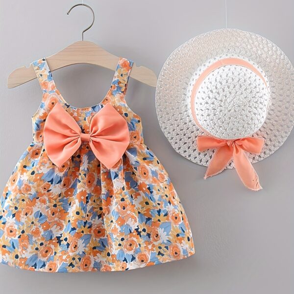 Baby girl wearing adorable Newness floral print dress and hat set perfect for summer