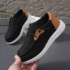 Stylish and comfortable blue canvas sneakers for boys perfect for playtime The shoes feature a classic design with durable construction