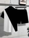 Stylish monochrome printed shirt and shorts set in breathable polyester perfect for summer Model is wearing the matching shirt and shorts