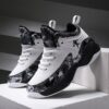Stylish and comfortable Rebellious Splatter Paint Shoes from Newness Durable breathable sneakers with a trendy splatter paint design perfect for young trendsetters