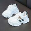 Adorable kids Playful Striped Sneakers with a cute bear charm showcasing Newnesss stylish and comfortable design