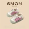 Stylish and comfortable blue canvas shoes for kids perfect for all day play Newness brand logo subtly visible