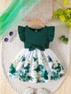 Adorable baby girl wearing a charming butterfly print dress from Newness perfect for spring and summer