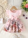Adorable girl wearing a vibrant Summer Bloom floral print dress perfect for summer The dress features a playful colorful floral pattern
