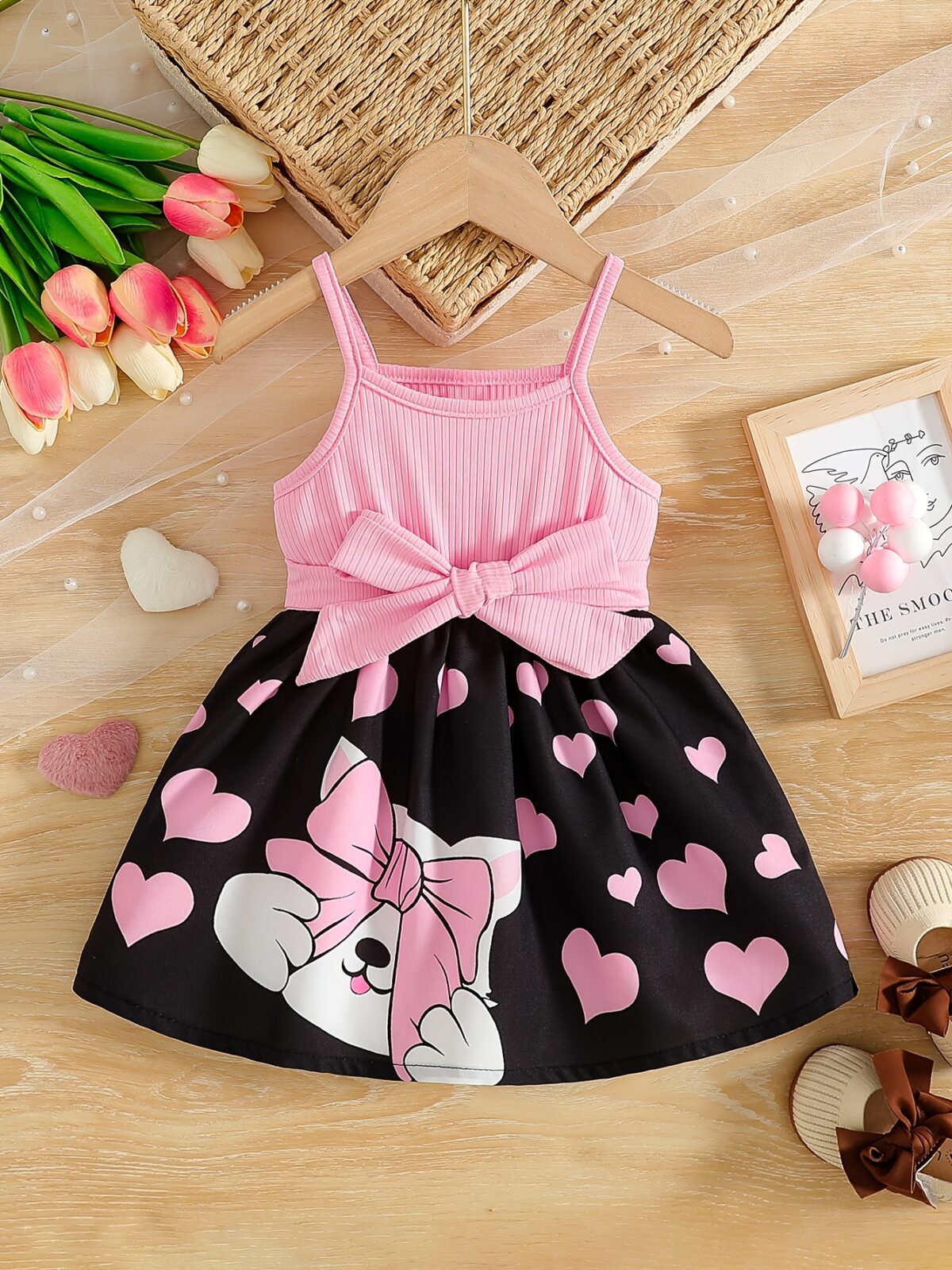 Sweetheart Summer Toddler Dress   Adorable little girl wearing a charming pink and white summer dress perfect for summer parties and outdoor play