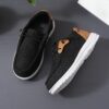 Stylish and comfortable blue canvas sneakers for boys perfect for playtime The shoes feature a classic design with durable construction