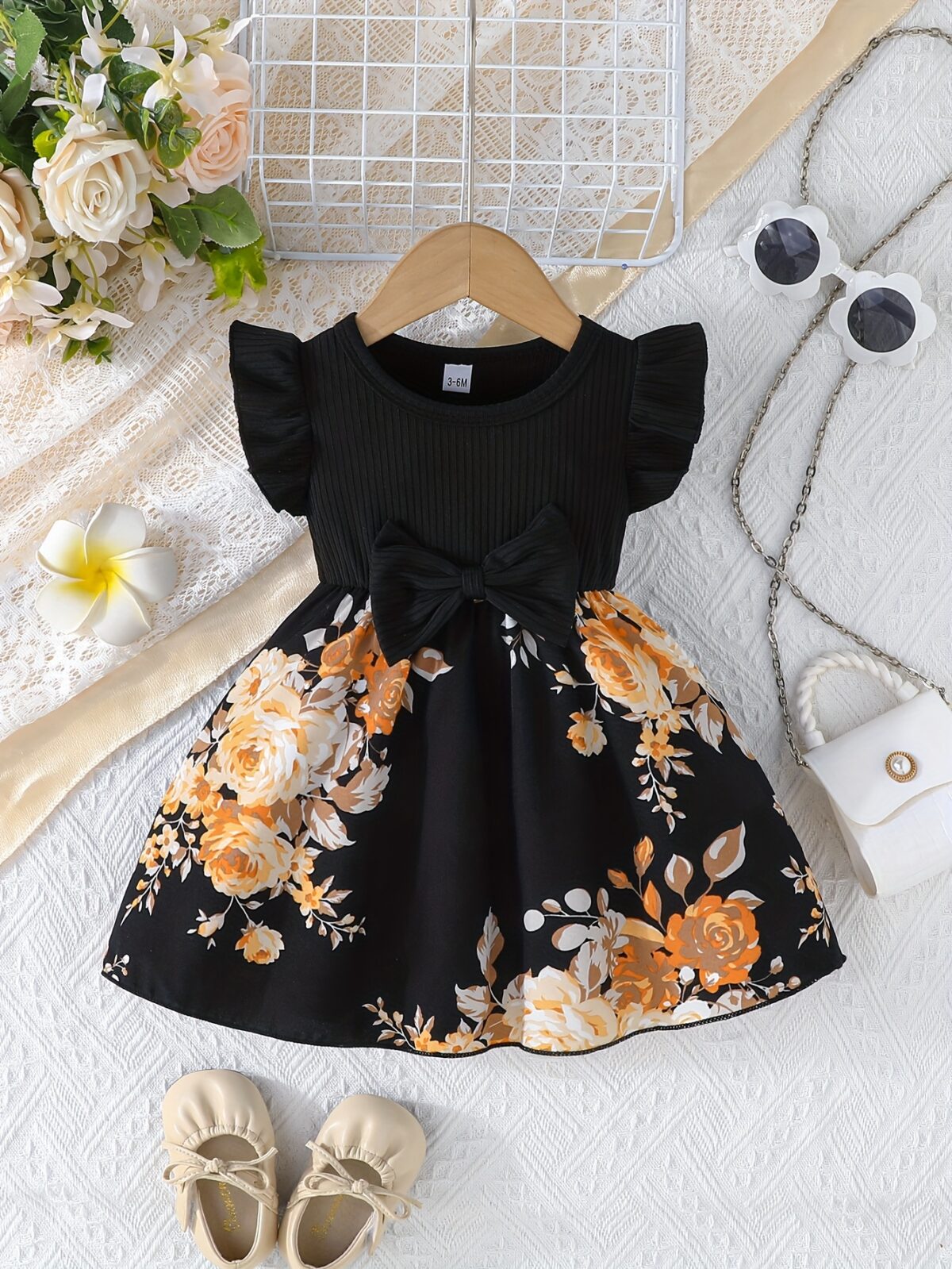 Adorable girl wearing a vibrant Summer Bloom floral print dress perfect for summer The dress features a playful colorful floral pattern