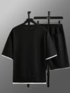 Model wearing the Newness Dubai Nights Mens Casual Sports Set a comfortable and stylish navy blue polyester athletic set perfect for lounging or working out
