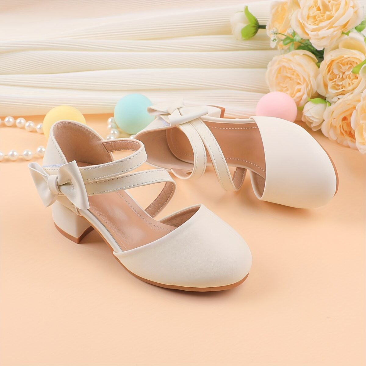 Adorable girls Mary Jane shoes with a delicate bow detail perfect for weddings parties and special occasions