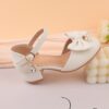 Adorable girls Pearl  Bow Mary Janes in white perfect for weddings parties and special occasions Featuring delicate pearls and charming bows