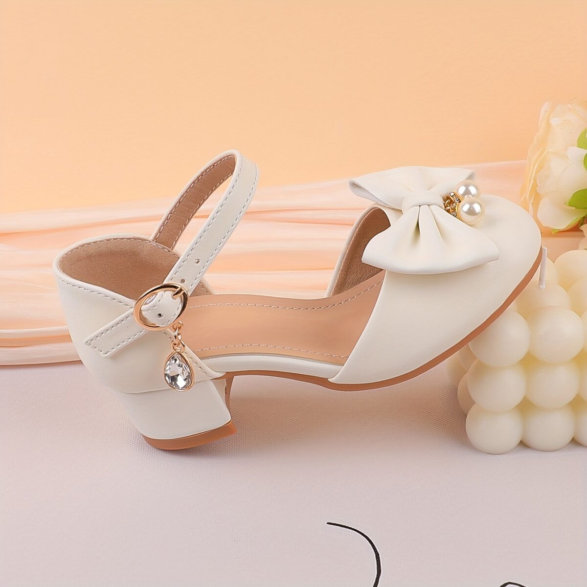 Adorable girls Pearl  Bow Mary Janes in white perfect for weddings parties and special occasions Featuring delicate pearls and charming bows