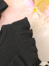 Petite Fleur A charming girl in a floral mesh dress twirling happily
