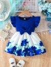 A little girl wearing a charming summer floral print dress