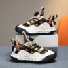 Stylish and comfortable Velocity Boys Sneakers in multiple colors perfect for any occasion Showcasing the sneakers design details and fit