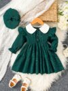 Adorable Emerald Isle doll collar dress and hat set in emerald green perfect for your little one The dress features a charming doll collar and the matching hat completes the outfit