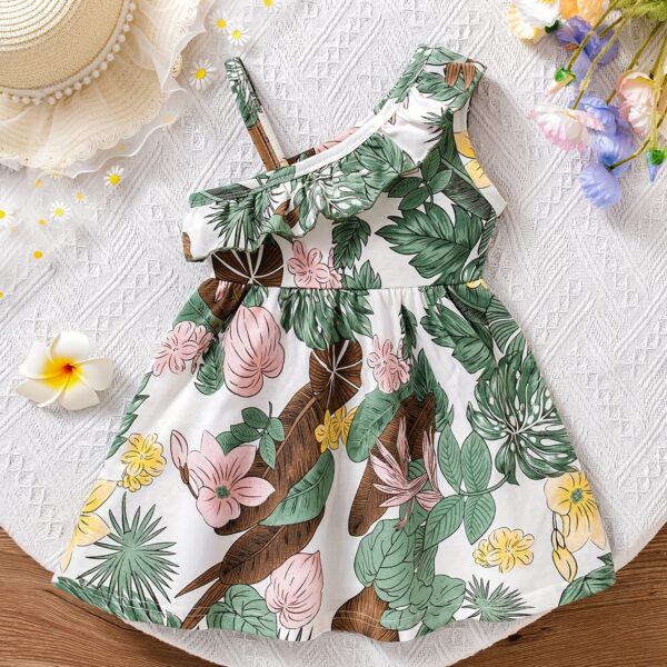 Baby girl wearing adorable Island Bloom floral print dress smiling