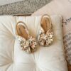 Close up of girls cute flat sandals in pink showing detail and comfort