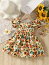 Baby girl wearing an adorable sunflower floral print dress perfect for summer