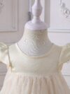 Adorable baby girl wearing a celestial themed tulle dress perfect for parties and special occasions
