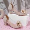 Adorable little girl wearing Newness Enchanted Garden Girls Block Heels showcasing the charming design and comfortable block heel