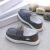 Stylish and comfortable blue canvas shoes for boys perfect for everyday wear The shoes feature a classic design with a touch of modern style