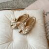 Close up of girls cute flat sandals in pink showing detail and comfort