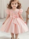 Adorable girl twirling in a lavender colored party dress perfect for birthdays and special occasions The dress features exquisite detailing and a flattering silhouette