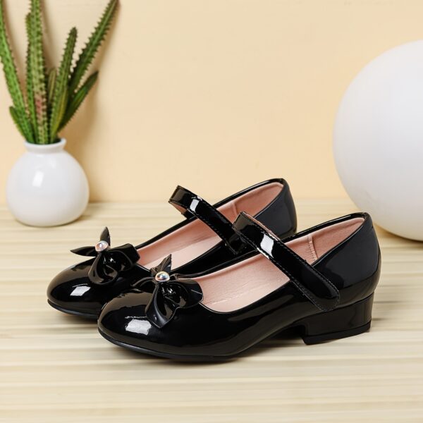 Adorable Darling Bow Girls Mary Janes in pink perfect for parties and everyday wear These classic Mary Janes feature a darling bow detail