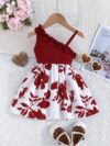 Adorable girl wearing a vibrant Summer Bloom floral print dress perfect for summer vacations