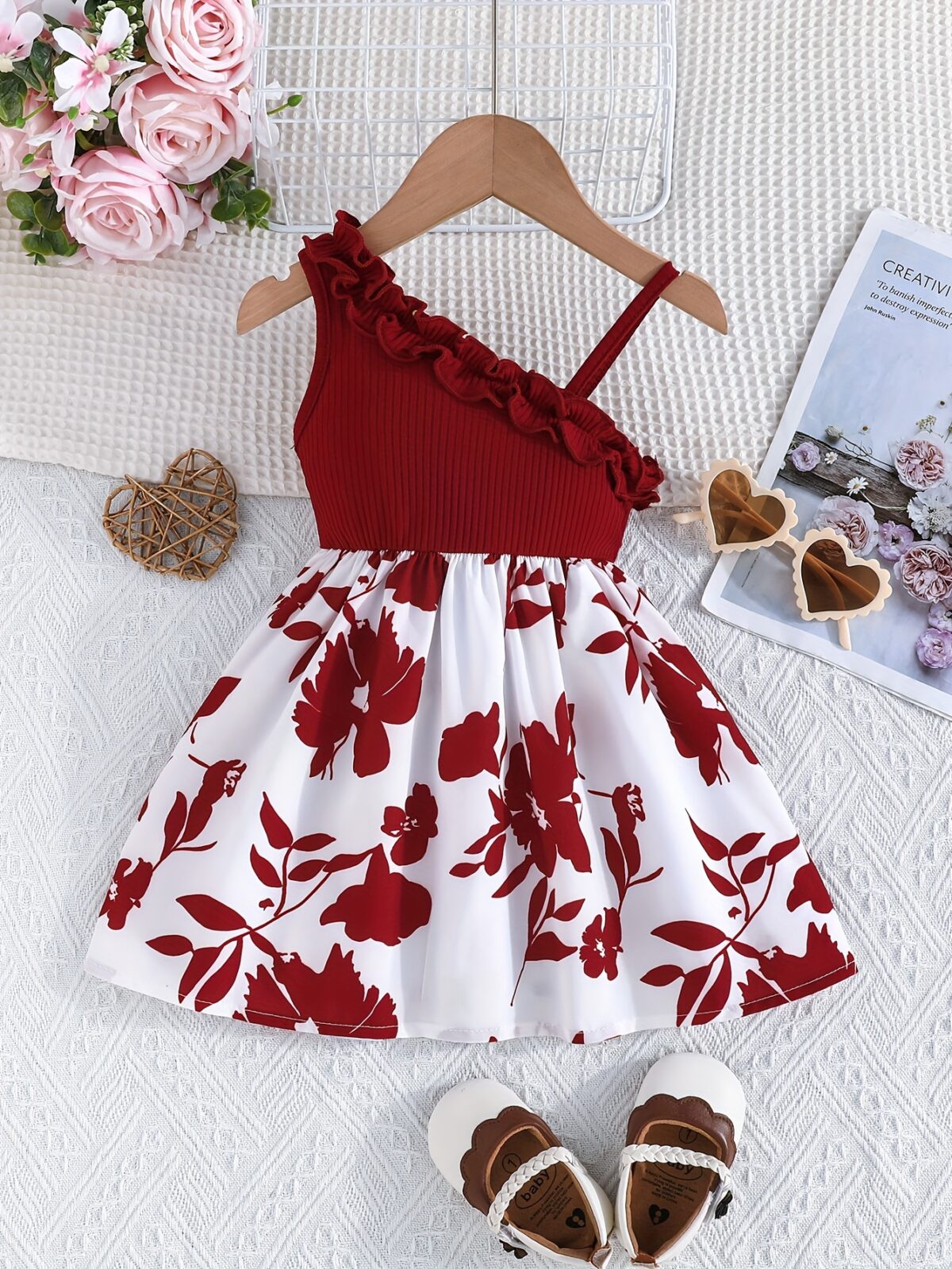 Adorable girl wearing a vibrant Summer Bloom floral print dress perfect for summer vacations