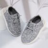 Stylish and comfortable Newness kids canvas loafers perfect for summer adventures Image shows childrens feet wearing the loafers