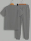 Model wearing the Newness Dubai Nights Mens Casual Set a stylish and comfortable two piece outfit perfect for summer evenings The set features a modern fit and breathable fabric