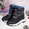 Stylish and durable Newness Explorer Kids Winter Boots perfect for snowy adventures Image shows children wearing the boots playing in the snow