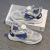 Newness Dynamic Play Kids Mesh Sneakers in action A boy energetically playing showcasing the stylish and breathable design of the shoes