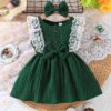 Toddler girl wearing a charming emerald green summer dress ideal for playing outdoors