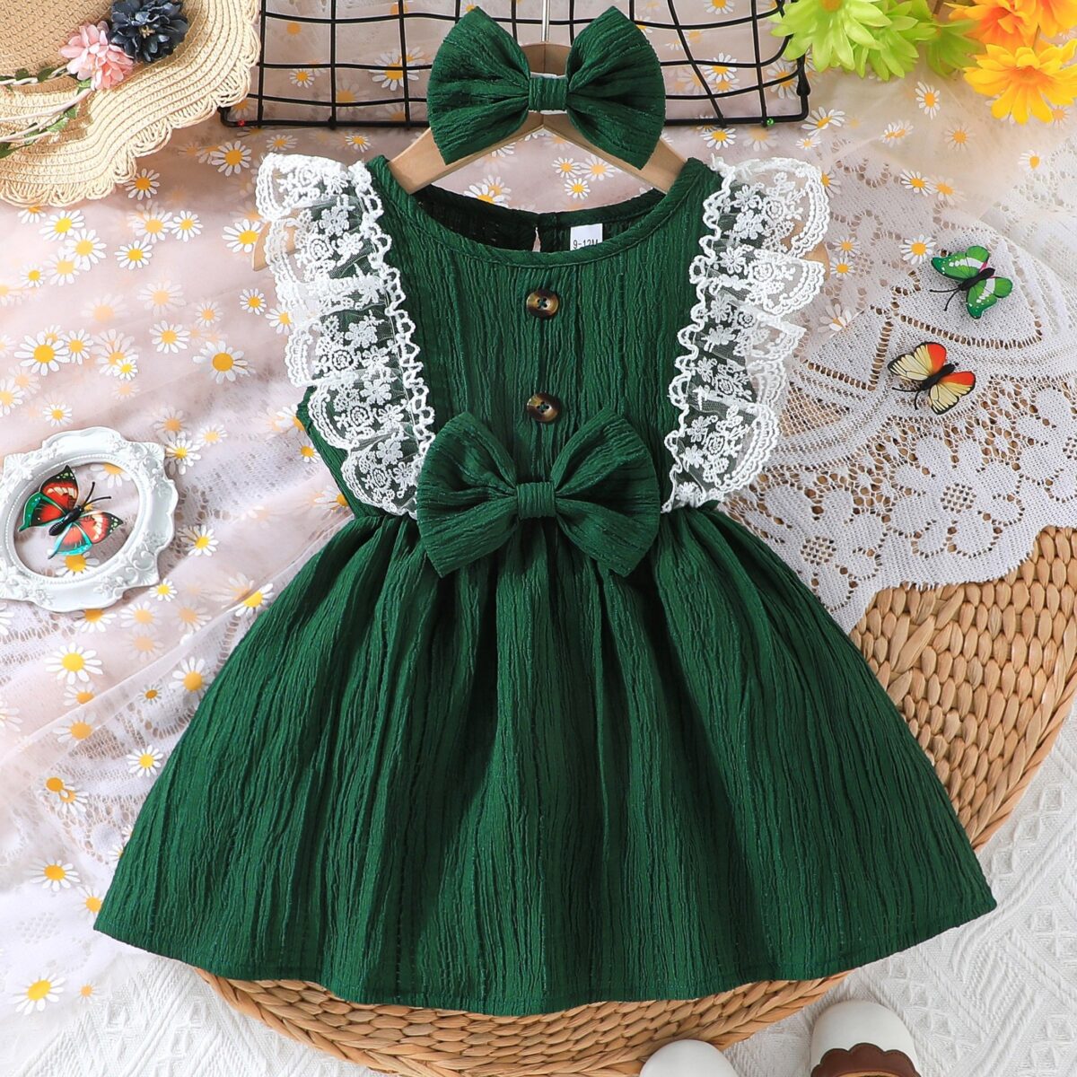 Toddler girl wearing a charming emerald green summer dress ideal for playing outdoors