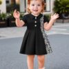 Adorable baby girl in a stylish and comfortable summer dress from Newness perfect for a playdate