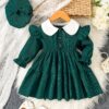 Adorable Emerald Isle doll collar dress and hat set in emerald green perfect for your little one The dress features a charming doll collar and the matching hat completes the outfit