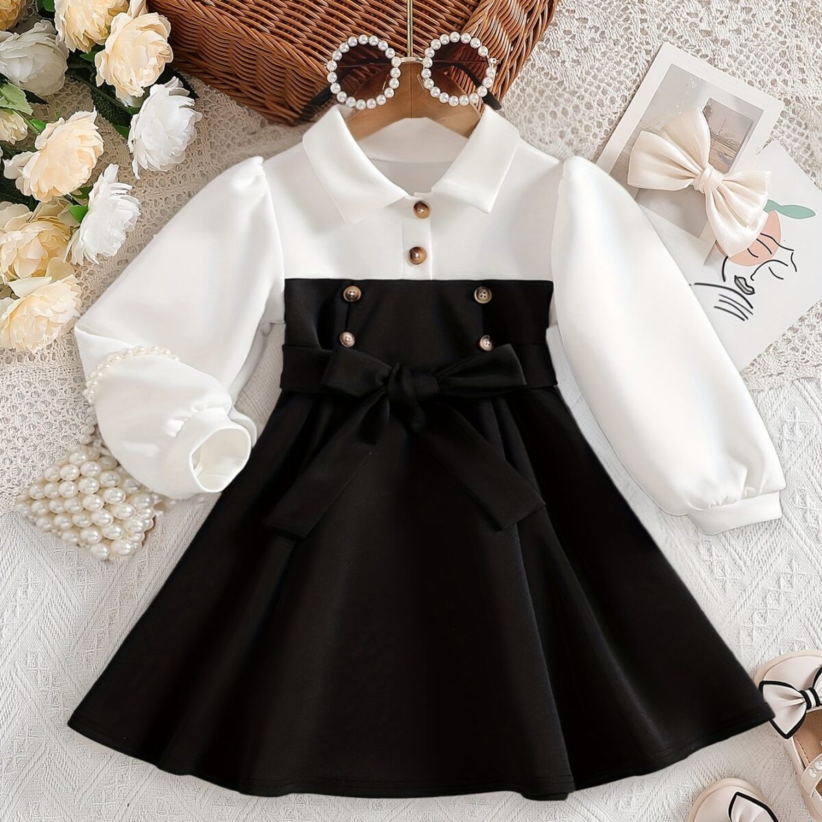Adorable baby girl wearing a Petite Darling Color Block Dress perfect for birthdays or back to school photos The dress features a vibrant color block design