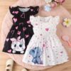 Adorable summer baby girl dress in a delightful heart and animal print Perfect for sunny days and special occasions