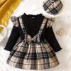 Adorable baby girl wearing a darling plaid skirt set and beret Perfect spring or fall outfit